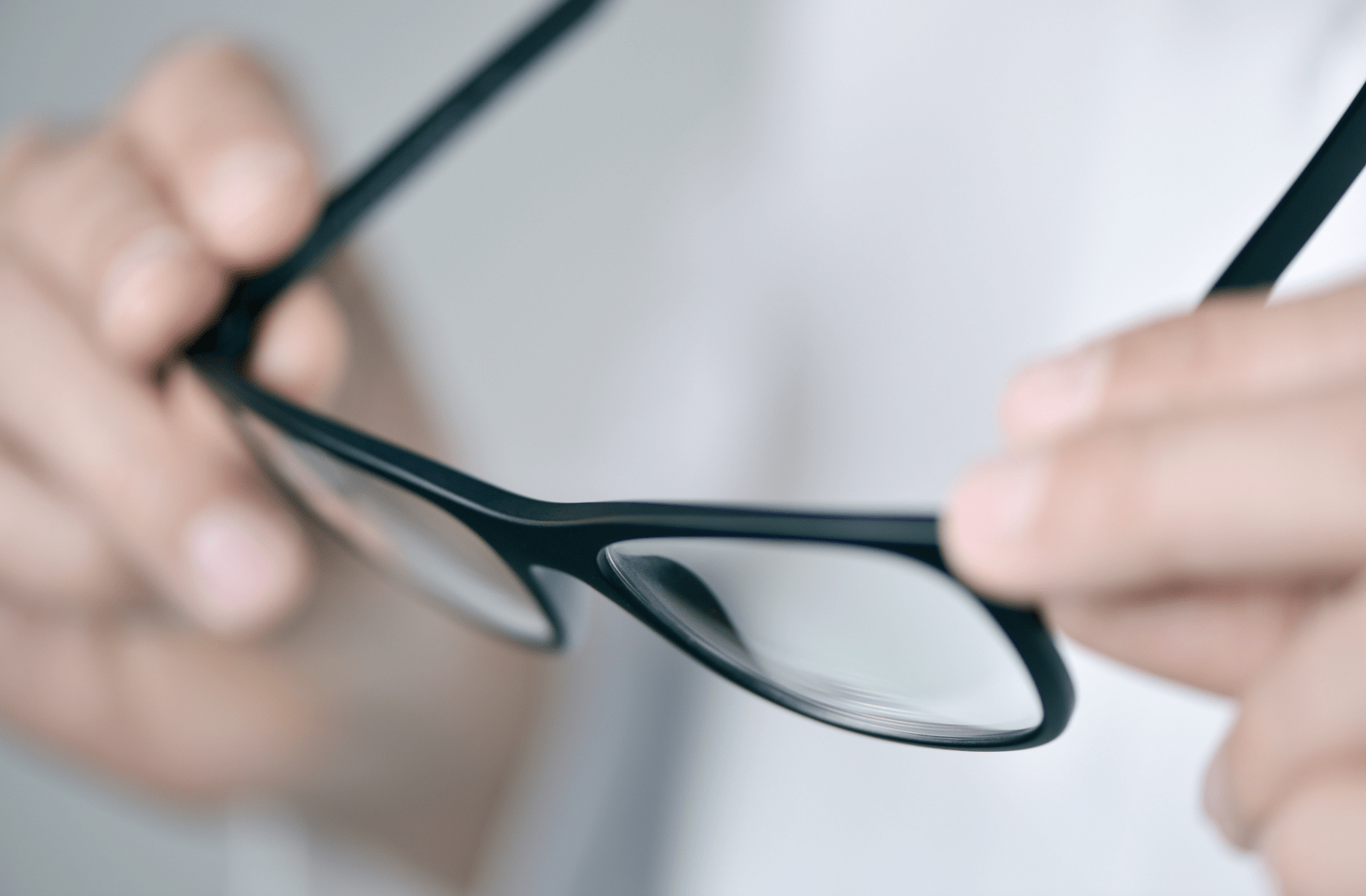 A close up image of a pair of black-rimmed glasses