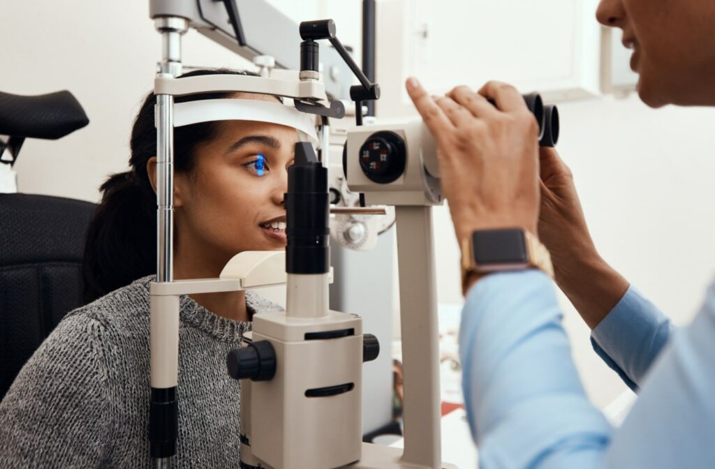 A young female patient undergoing preliminary testing at her routine eye exam.