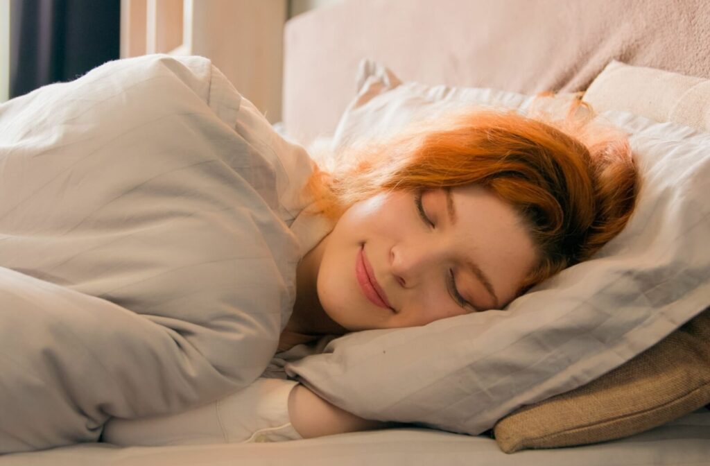 A woman sleeps while wearing her vision correction contact lenses.